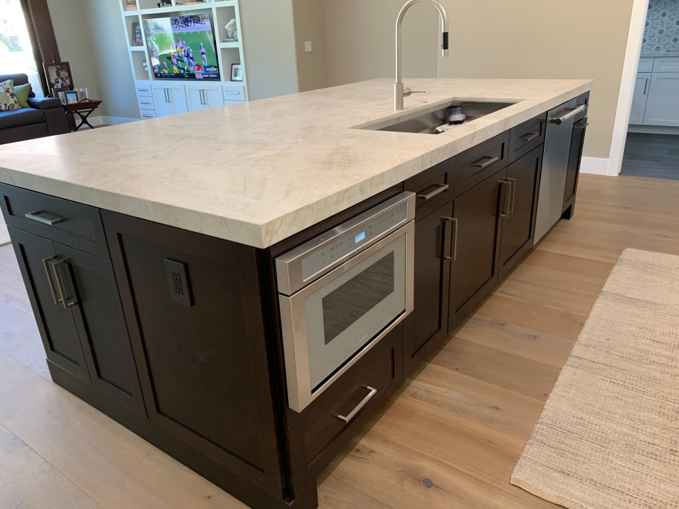 This is an example of a large contemporary kitchen in Las Vegas with shaker cabinets and with island.