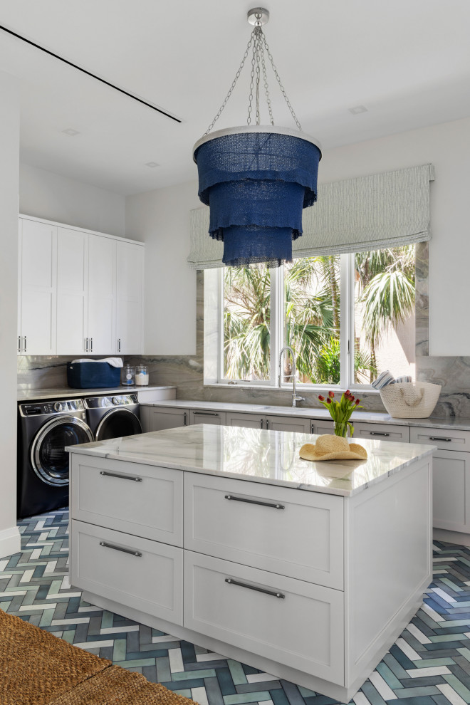 Example of a beach style laundry room design in Tampa