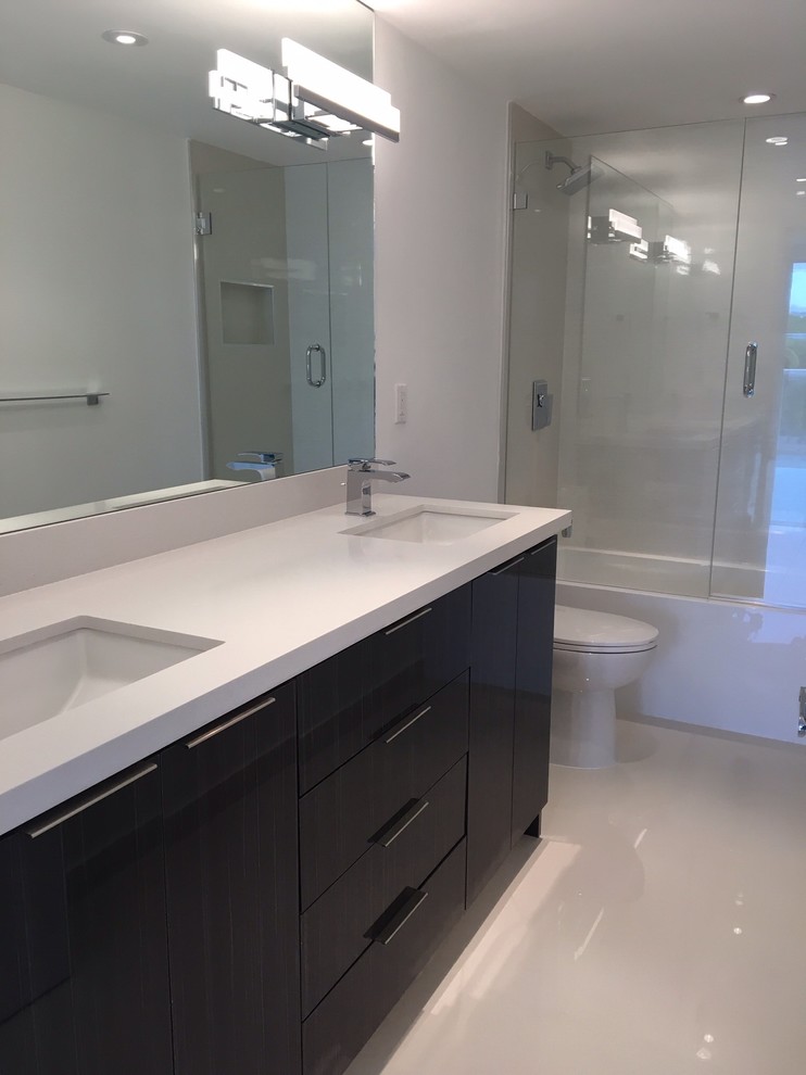 Dark gray vanity with contemporary sconces