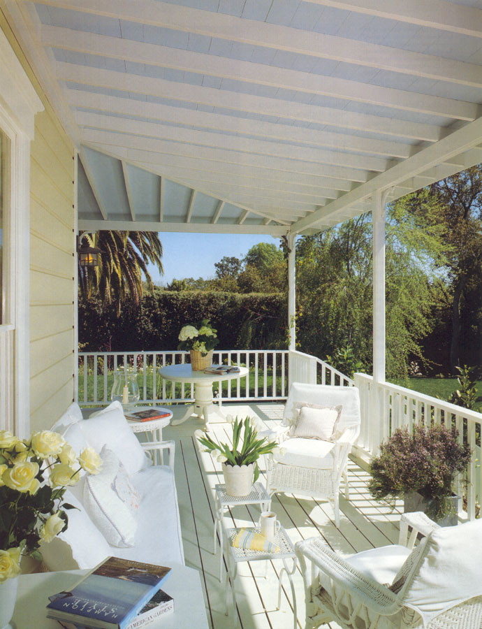 This is an example of a mid-sized country backyard verandah in Santa Barbara with decking and a roof extension.