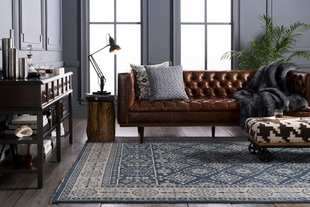 Family room - mid-sized traditional open concept dark wood floor and brown floor family room idea in Dallas with a bar, blue walls and no tv