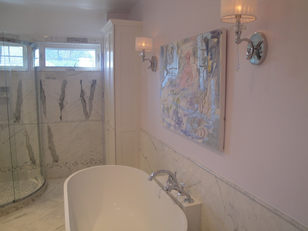 This is an example of a mid-sized eclectic master bathroom in New York with a freestanding tub, pink walls, marble floors, a curbless shower, blue tile, gray tile, white tile, mosaic tile, grey floor and a sliding shower screen.