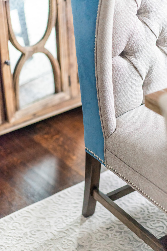 Example of a large transitional medium tone wood floor and brown floor enclosed dining room design in Toronto with blue walls and no fireplace