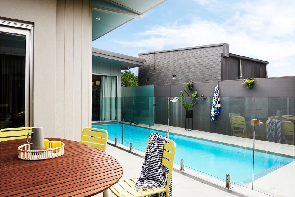 Photo of a contemporary backyard rectangular lap pool in Sydney.