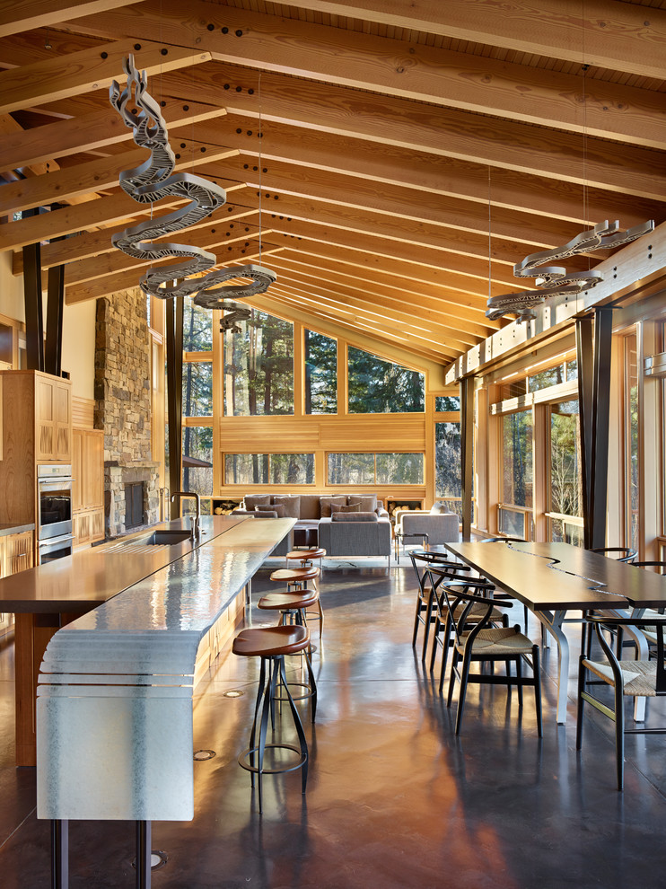 Inspiration for a large contemporary open plan dining in Seattle with concrete floors.