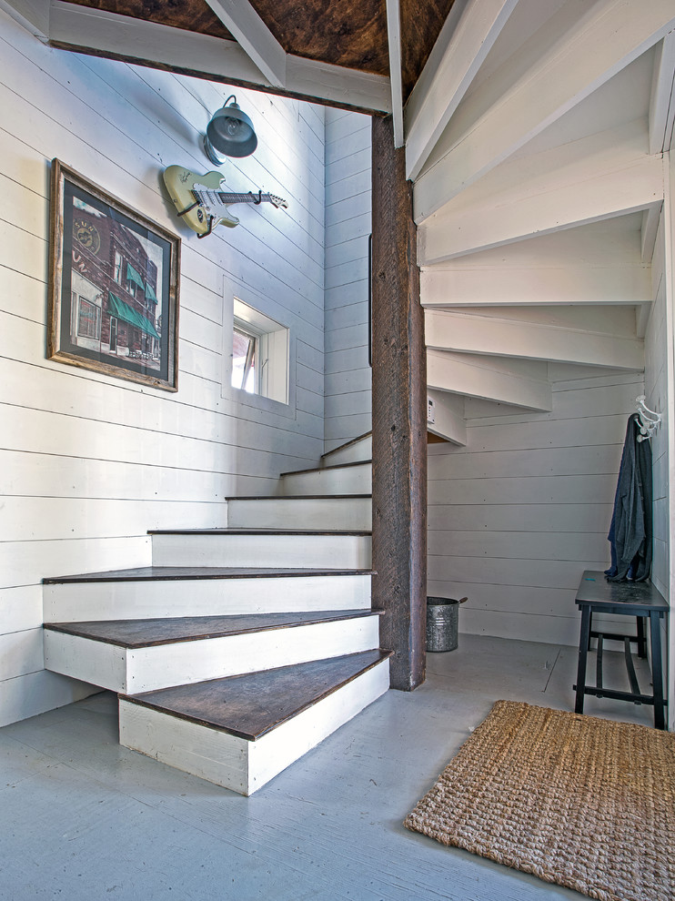 Mid-sized contemporary wood spiral staircase in Other with wood risers.