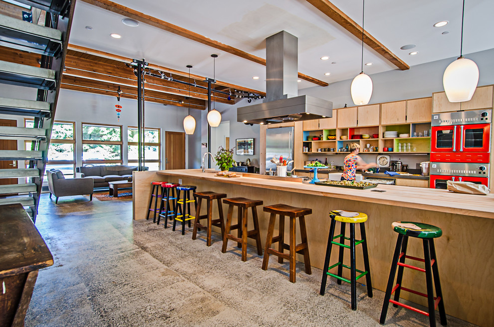 Industrial galley open plan kitchen in Seattle with open cabinets.