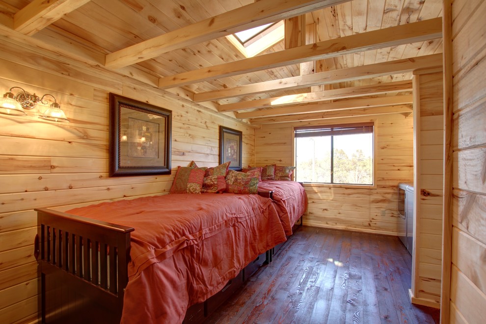 Inspiration for a country guest bedroom in Phoenix with dark hardwood floors and brown floor.