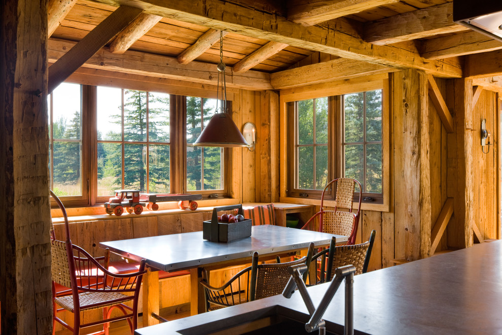 Dining room - rustic medium tone wood floor dining room idea with no fireplace