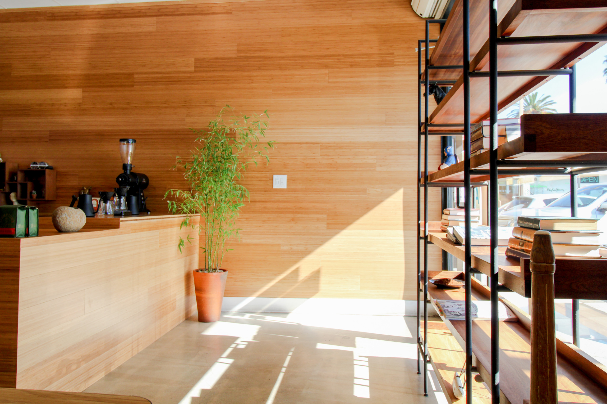 Los Angeles, CA - Commercial Coffee House Renovation Installation of Bamboo wood paneling, tile flooring and counter area.