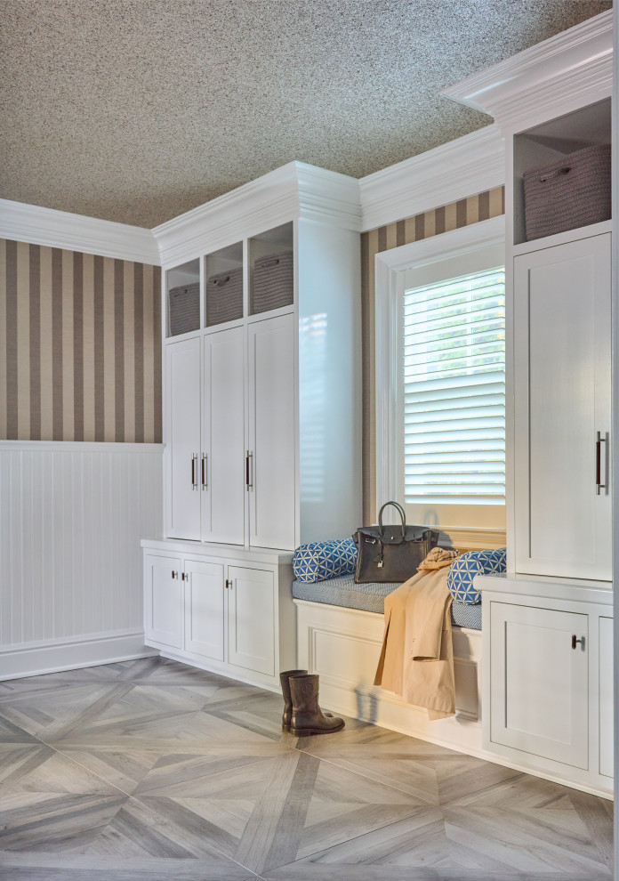 Example of a mid-sized transitional porcelain tile, gray floor and wallpaper mudroom design in New York with multicolored walls