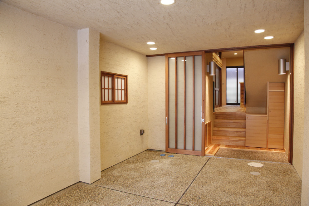Modern entryway in Kyoto with white walls, a sliding front door, a medium wood front door, beige floor, timber and planked wall panelling.