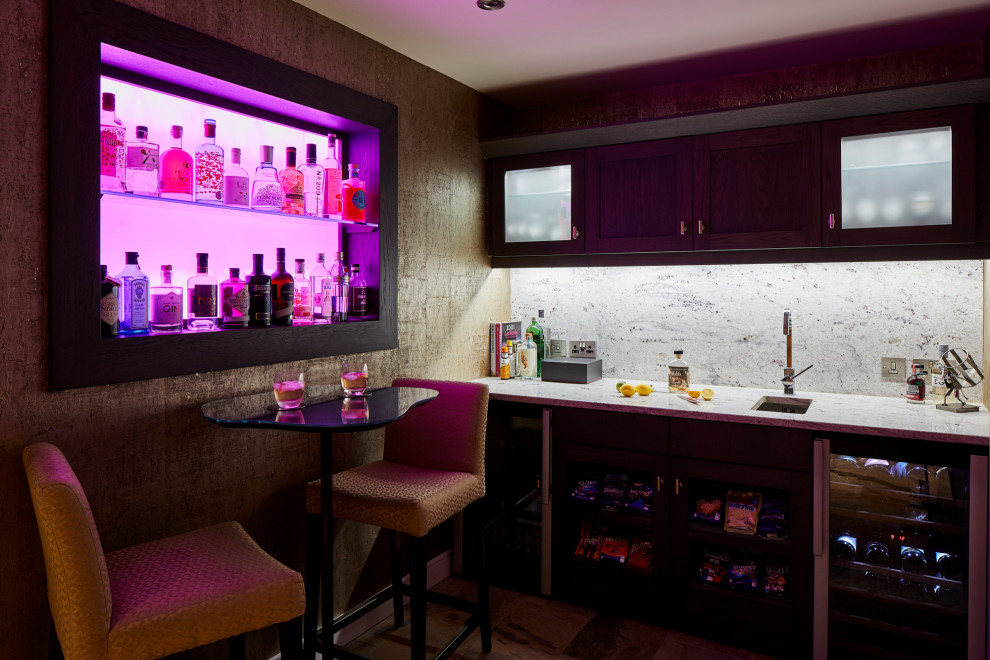 Photo of a small contemporary single-wall wet bar in West Midlands with an integrated sink, open cabinets, dark wood cabinets, granite benchtops, white splashback, granite splashback, ceramic floors, beige floor and grey benchtop.