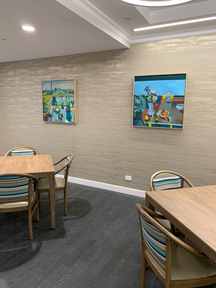 Inspiration for a contemporary dining room in Melbourne with laminate floors and grey floor.