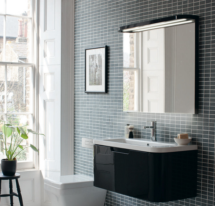 Design ideas for a mid-sized contemporary kids bathroom in Cambridgeshire with flat-panel cabinets, white cabinets, a drop-in tub, a curbless shower, a one-piece toilet, gray tile, porcelain tile, grey walls, marble floors and a pedestal sink.