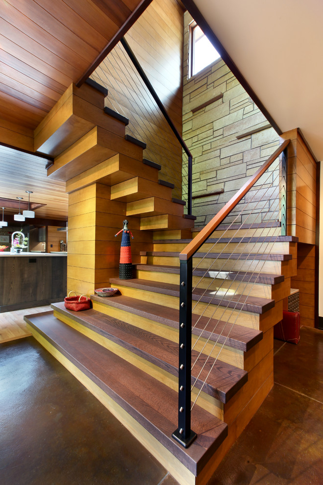 Inspiration for a large country wood u-shaped staircase in Grand Rapids with wood risers.