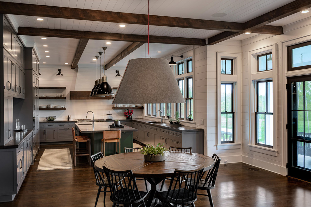 Large country u-shaped eat-in kitchen in New York with a single-bowl sink, grey cabinets, concrete benchtops, stainless steel appliances, dark hardwood floors, with island, brown floor, black benchtop, white splashback, timber splashback and shaker cabinets.