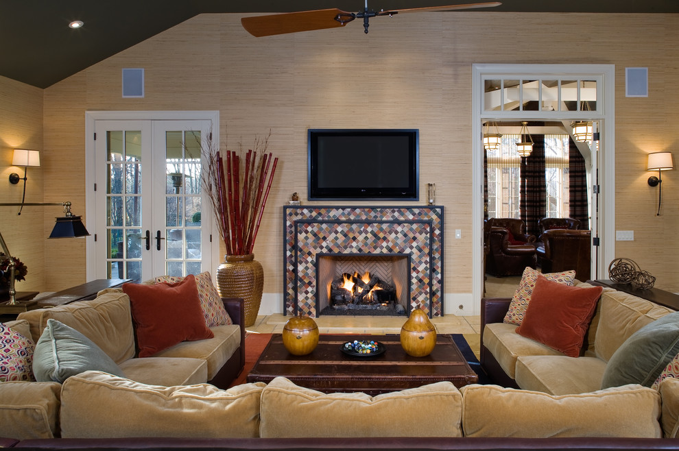 Inspiration for a mid-sized traditional open concept family room in Philadelphia with a tile fireplace surround, beige walls, medium hardwood floors, a standard fireplace and a wall-mounted tv.