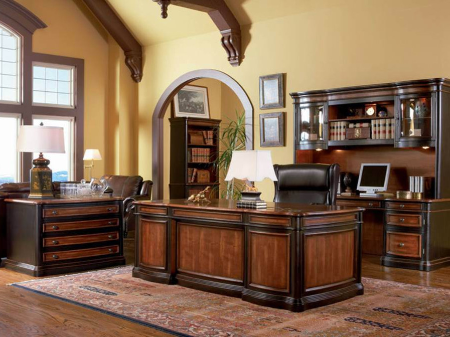 Design ideas for a large traditional study room in Detroit with yellow walls, dark hardwood floors, no fireplace and a freestanding desk.