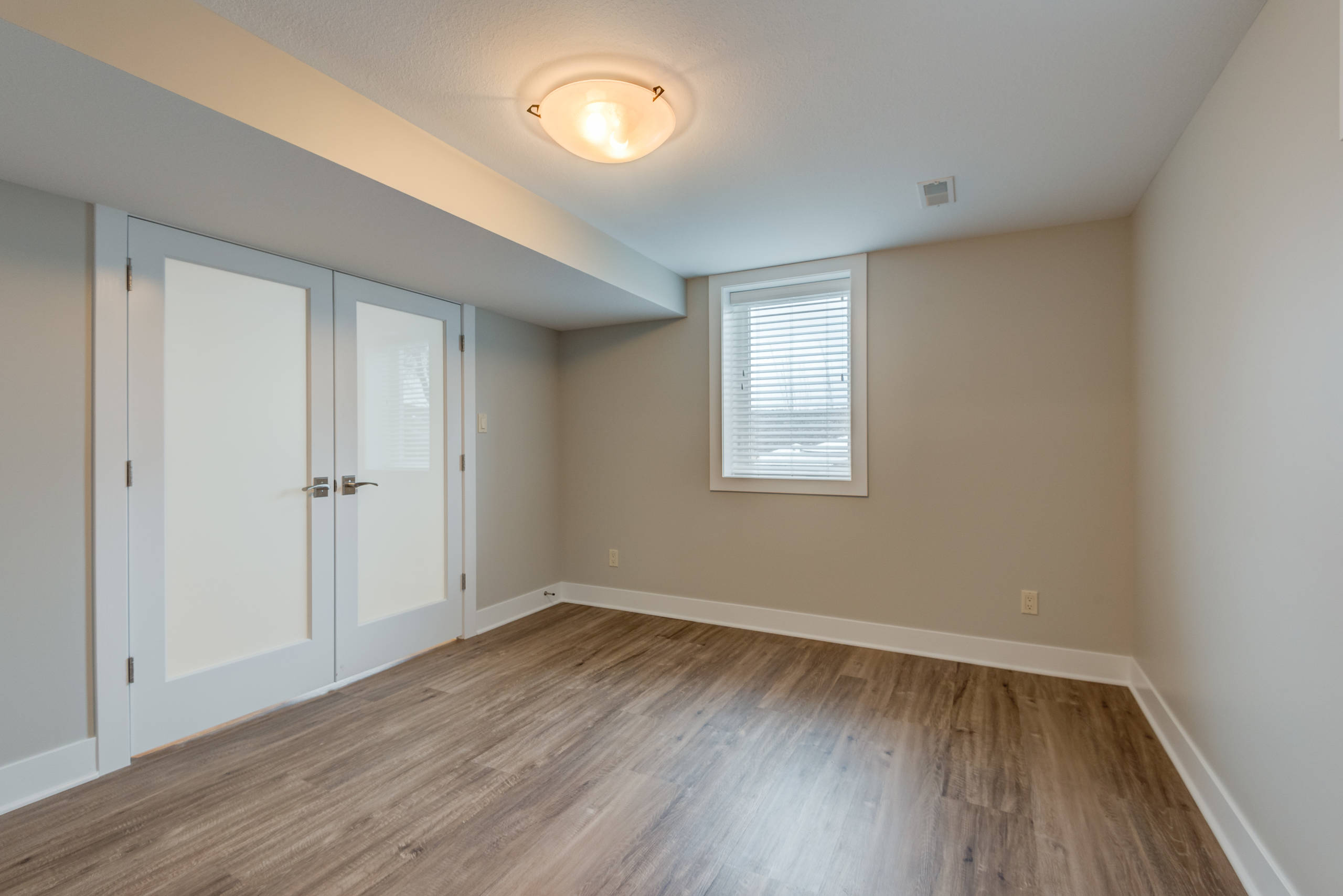 Transitional Modern Basement with Guest Bedroom Paxton