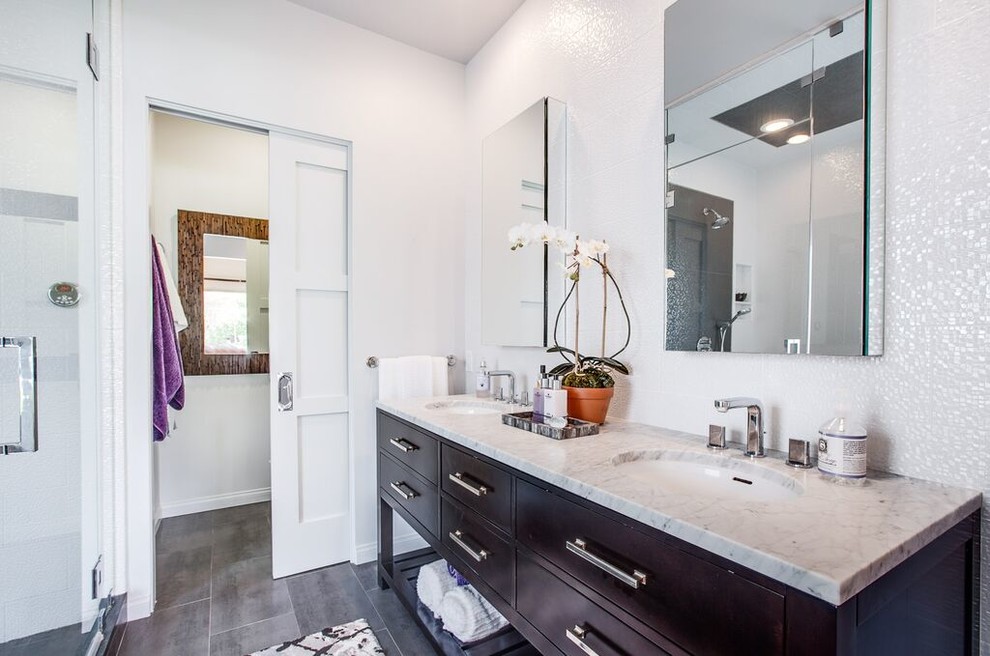 Photo of a mid-sized contemporary master bathroom in Los Angeles with beaded inset cabinets, dark wood cabinets, an alcove shower, white tile, porcelain tile, white walls, porcelain floors, an undermount sink and granite benchtops.