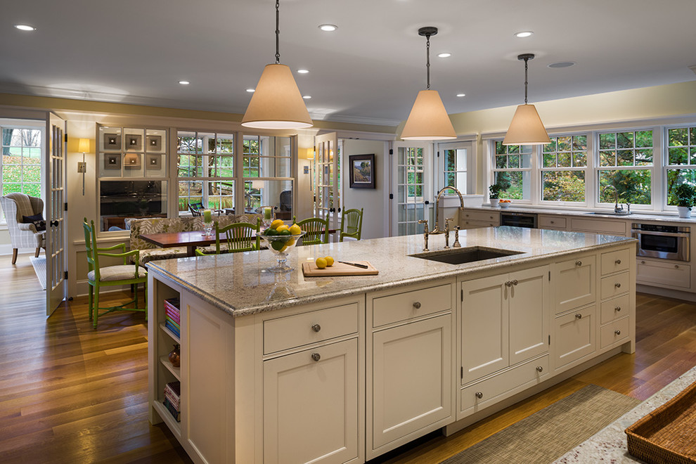 Traditional eat-in kitchen in Philadelphia with an undermount sink, recessed-panel cabinets and white cabinets.