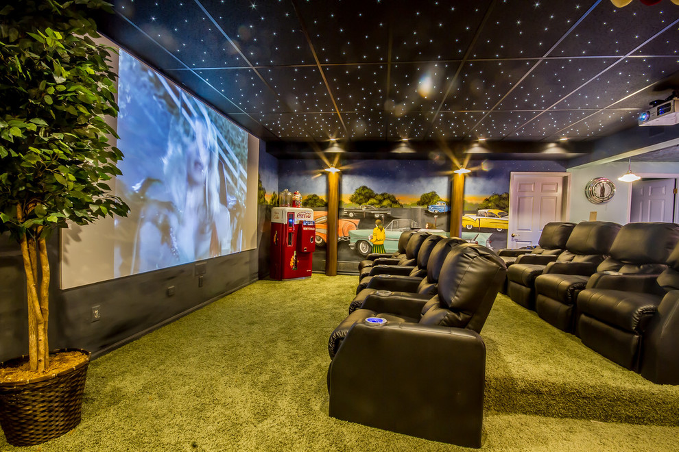 Design ideas for a transitional enclosed home theatre in Detroit with multi-coloured walls, carpet, a projector screen and green floor.