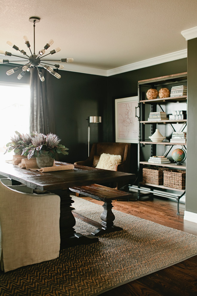 Inspiration for a mid-sized transitional study room in Denver with black walls, dark hardwood floors, no fireplace and a freestanding desk.