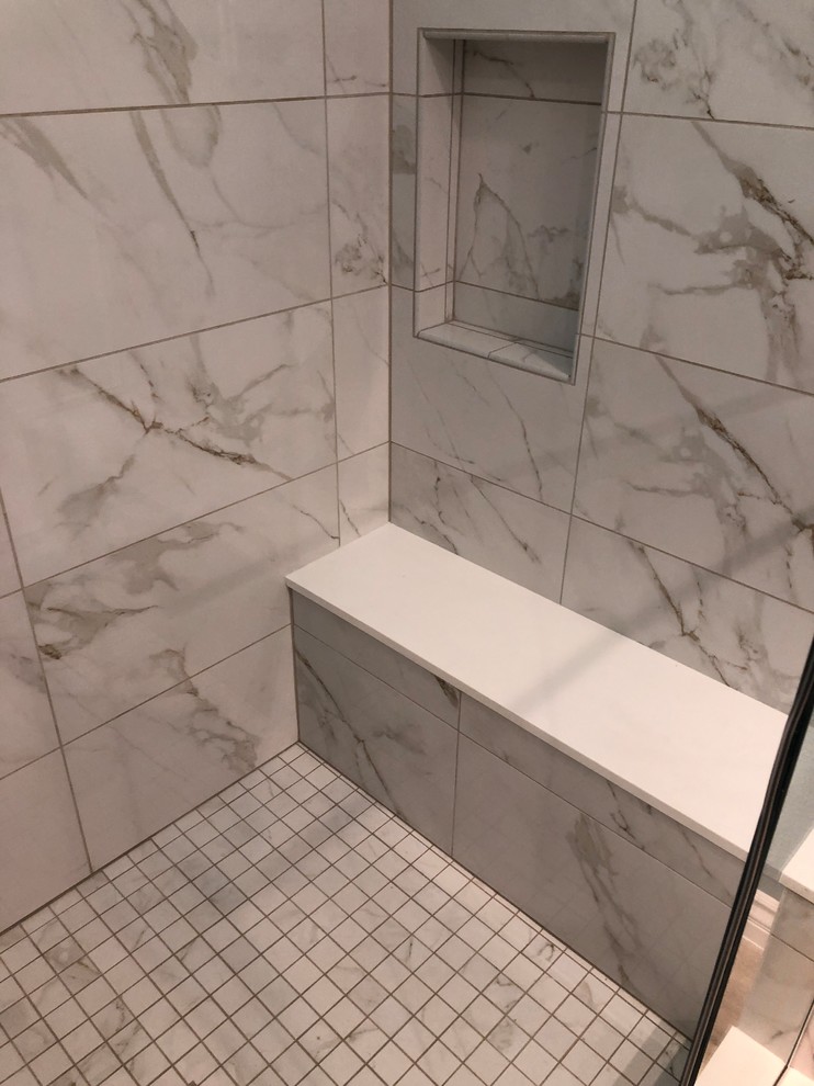 Design ideas for a large contemporary master bathroom in Los Angeles with flat-panel cabinets, medium wood cabinets, a one-piece toilet, gray tile, porcelain tile, blue walls, vinyl floors, an undermount sink, engineered quartz benchtops, beige floor, a hinged shower door and white benchtops.