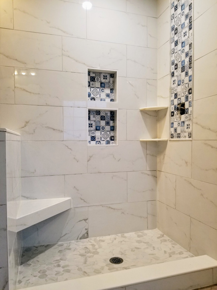Inspiration for a large contemporary master bathroom in DC Metro with an open shower, white tile, porcelain tile, pebble tile floors, grey floor and a niche.