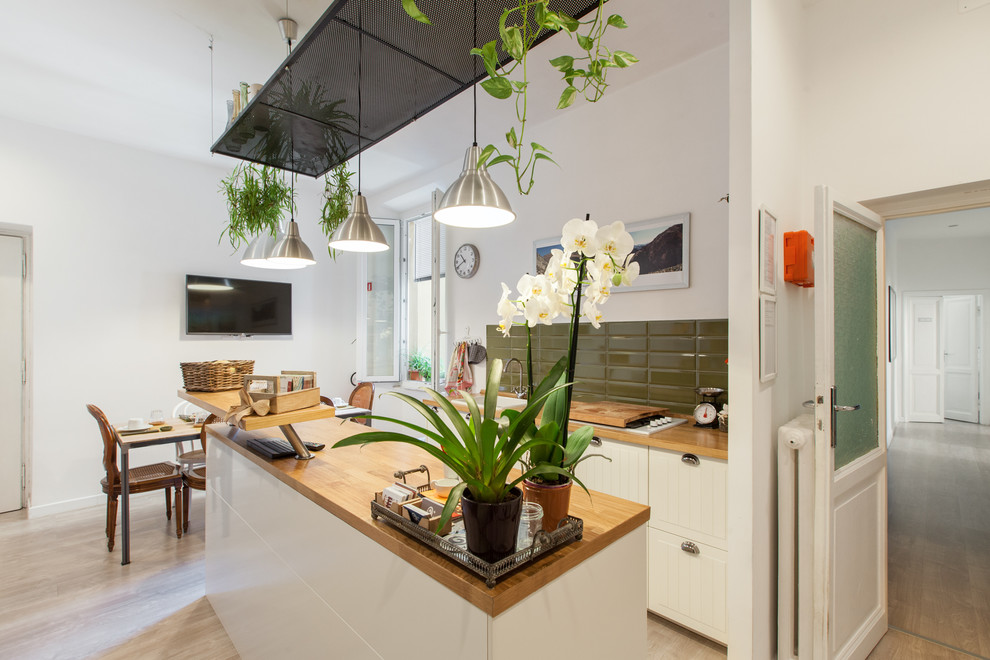 Mid-sized scandinavian galley eat-in kitchen in Rome with a drop-in sink, wood benchtops, green splashback, ceramic splashback, with island, shaker cabinets and medium hardwood floors.