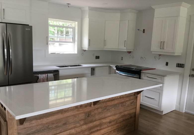 Inspiration for a small transitional kitchen remodel with quartz countertops, stainless steel appliances and white countertops