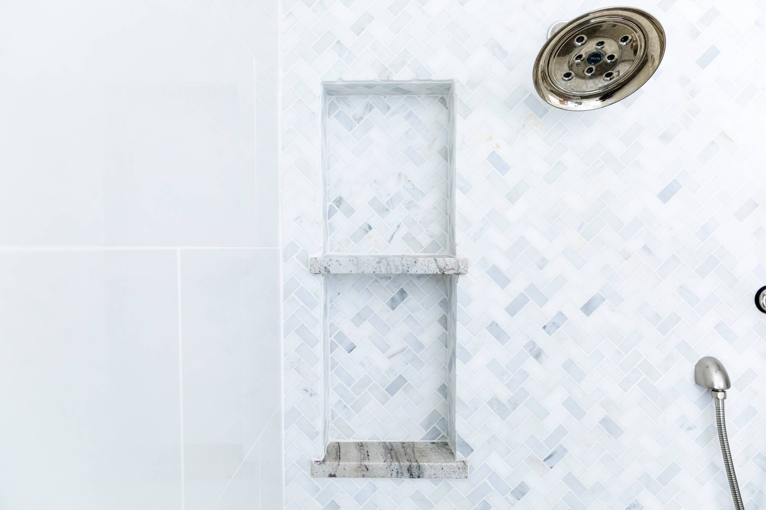 Close up of tiles in shower. Space Planning by Ourso Designs. Photo by Collin Richie (Collin Richie Photography).