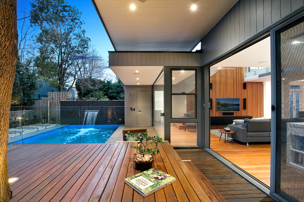 Design ideas for a modern backyard garden in Sydney with decking.