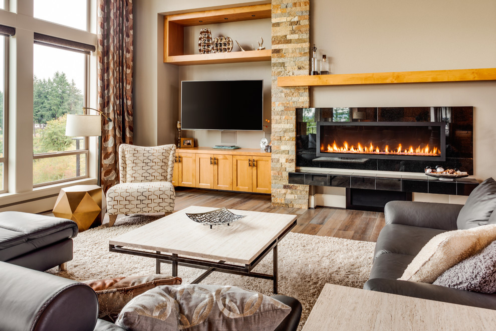 Photo of a large contemporary formal open concept living room in DC Metro with beige walls, dark hardwood floors, a ribbon fireplace, a tile fireplace surround and a wall-mounted tv.