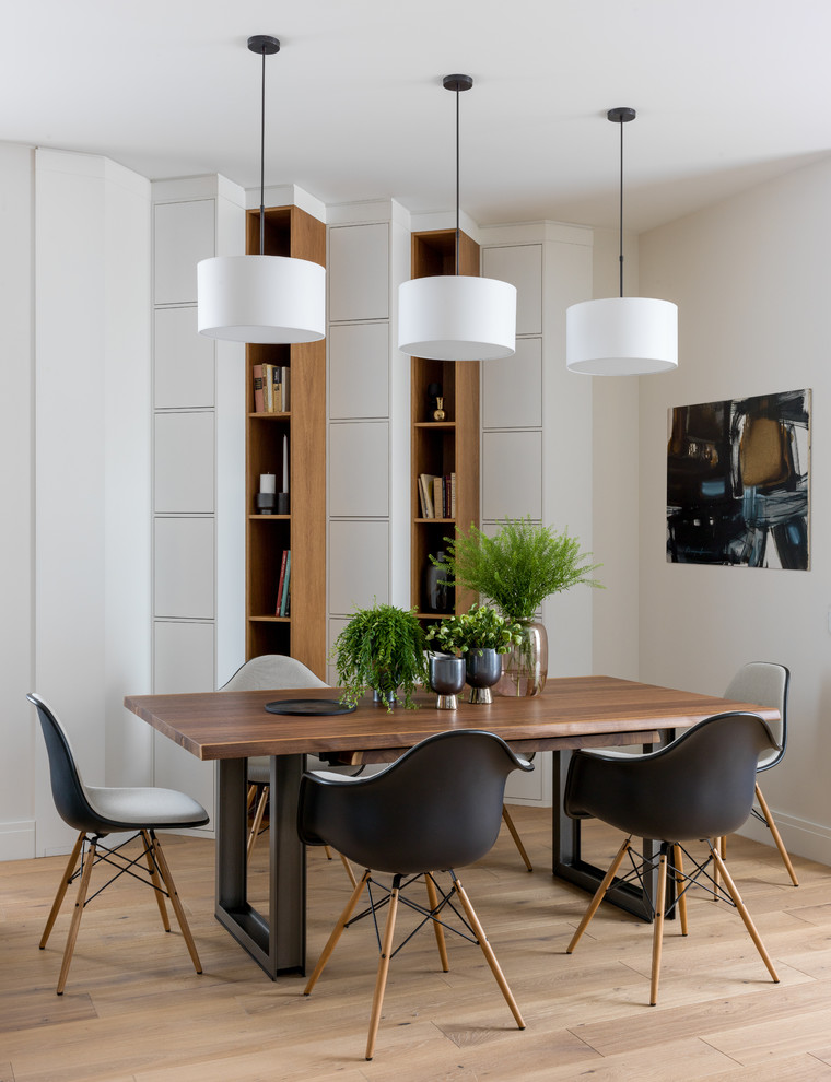 Inspiration for a contemporary open plan dining in Moscow with white walls, light hardwood floors and beige floor.