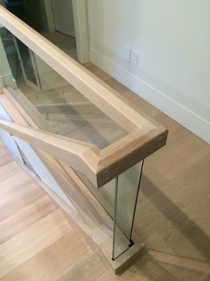 Design ideas for a large contemporary wood straight staircase in Vancouver with open risers and mixed railing.