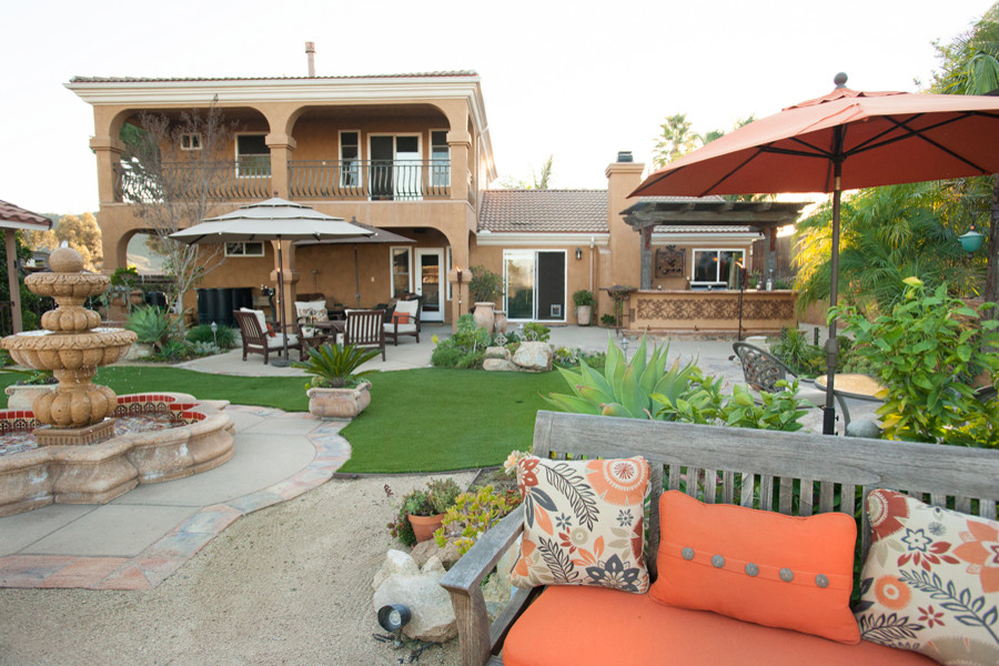 Photo of a large backyard partial sun garden for summer in San Diego with a water feature and gravel.