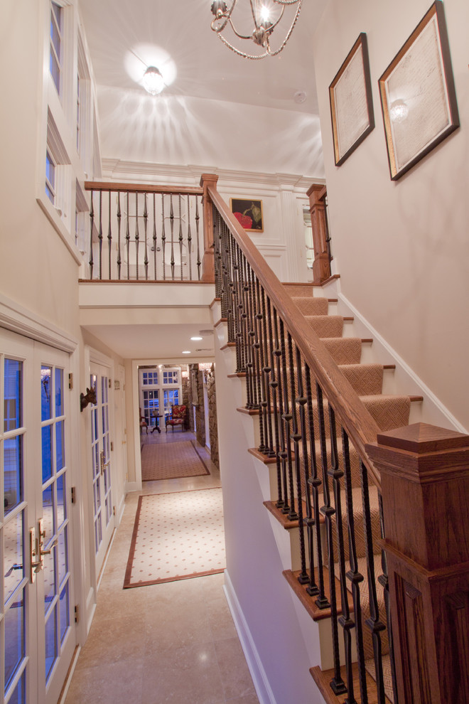 Inspiration for a mid-sized traditional wood straight staircase in Philadelphia with painted wood risers.