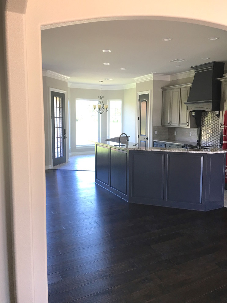 Mid-sized transitional dark wood floor and brown floor foyer photo in Dallas with beige walls and a dark wood front door