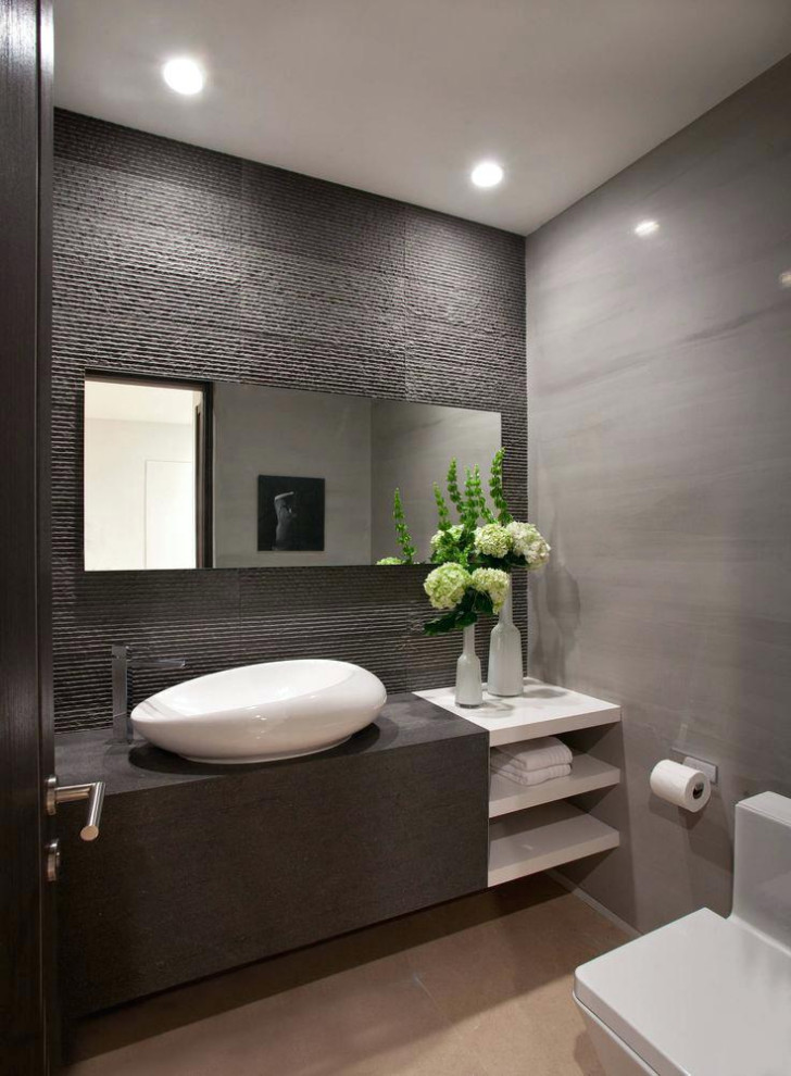 Mid-sized contemporary powder room in Dallas with flat-panel cabinets, brown cabinets, a one-piece toilet, grey walls, a vessel sink, beige floor, brown benchtops and a built-in vanity.
