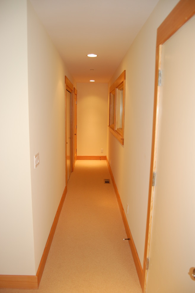 Mid-sized hallway in Orange County with white walls and carpet.