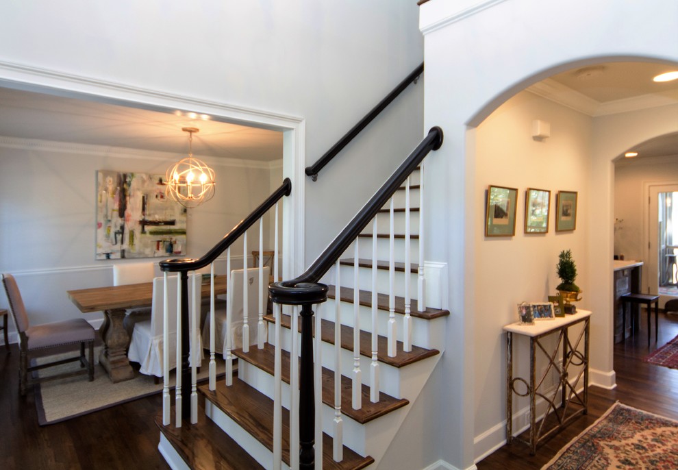 Mid-sized transitional wood straight staircase in Atlanta with painted wood risers.