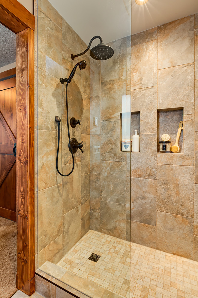 This is an example of a small country 3/4 bathroom in Calgary with furniture-like cabinets, medium wood cabinets, an open shower, a one-piece toilet, multi-coloured tile, stone slab, beige walls, ceramic floors, a pedestal sink and engineered quartz benchtops.