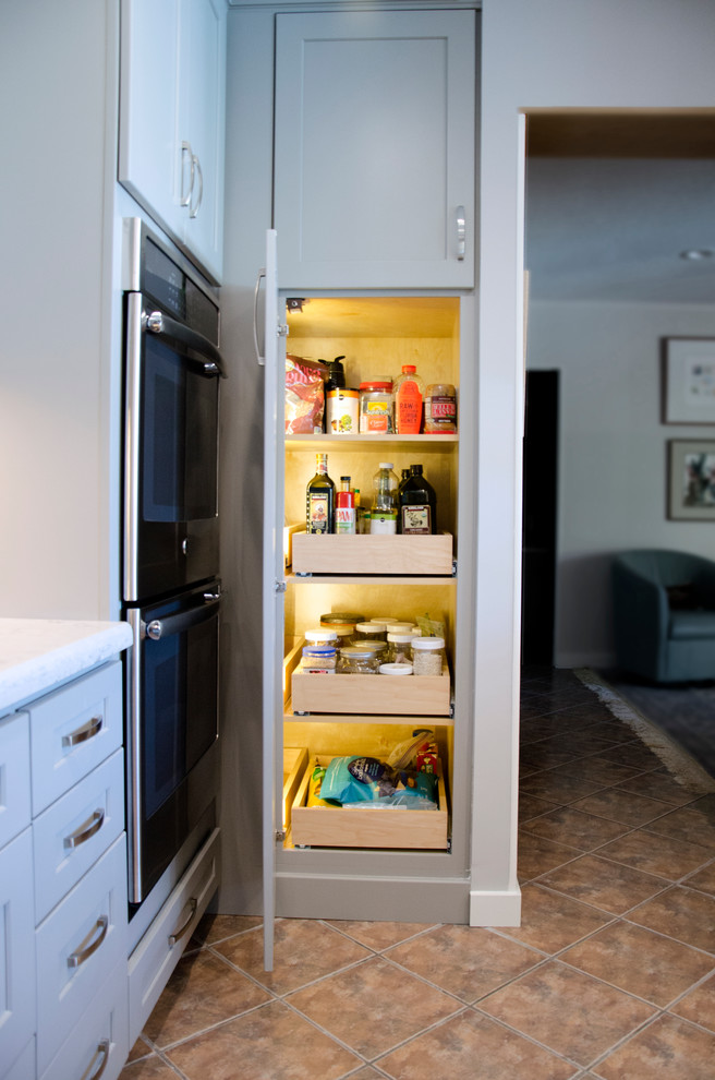 Inspiration for a mid-sized transitional u-shaped open concept kitchen remodel in Miami with an undermount sink, shaker cabinets, gray cabinets, quartzite countertops, gray backsplash, porcelain backsplash, stainless steel appliances and an island