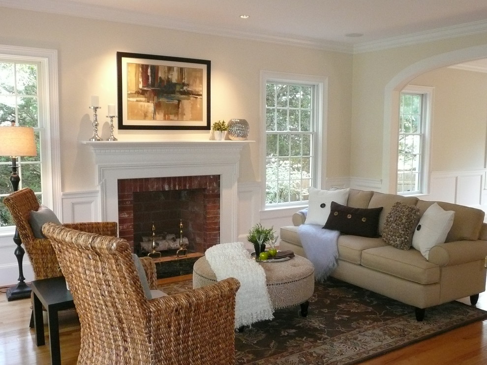 Design ideas for a mid-sized traditional open concept living room in Boston with beige walls, light hardwood floors, a standard fireplace and a wood fireplace surround.