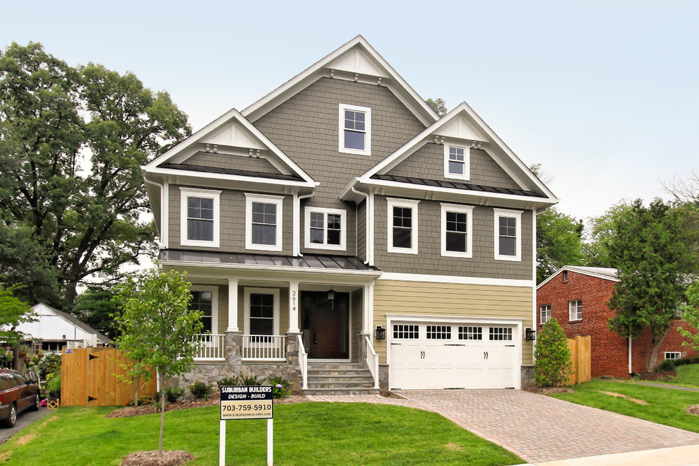 This is an example of a large arts and crafts three-storey grey exterior in DC Metro with wood siding and a gable roof.
