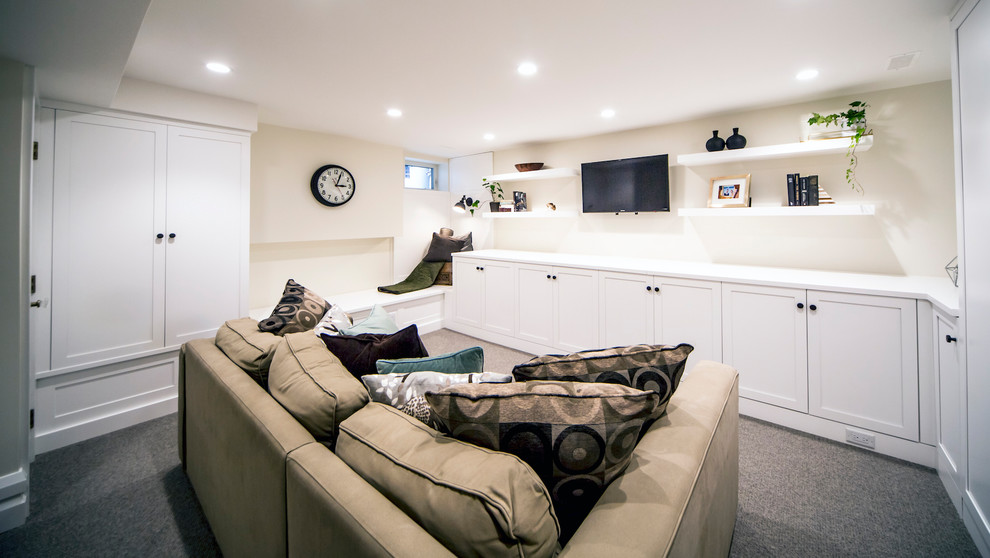 Design ideas for a small transitional look-out basement in Ottawa with beige walls, carpet and grey floor.