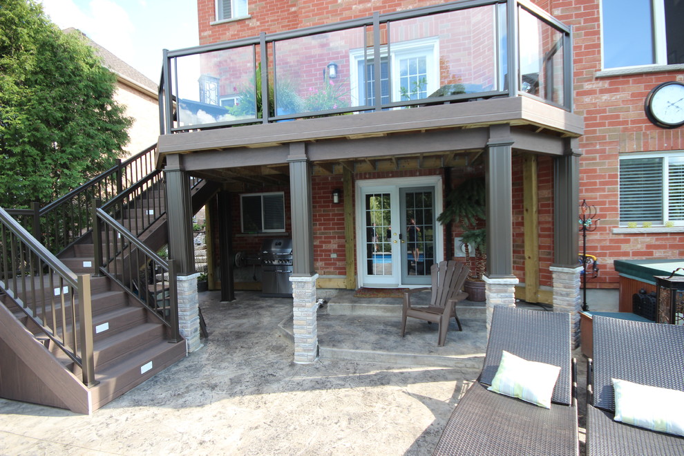 Mid-sized minimalist backyard deck photo in Toronto