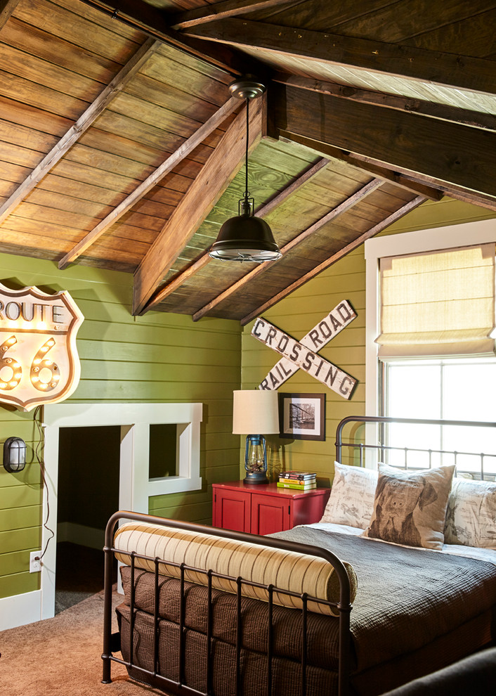 Photo of a mid-sized country guest bedroom in Charlotte with green walls, carpet and a standard fireplace.